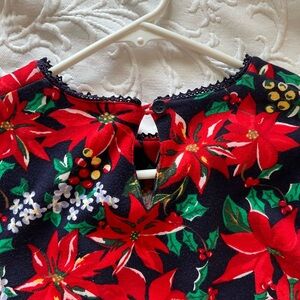 Festive Floral Top with Red and Green Poinsettias